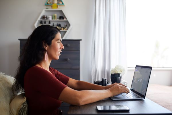 Woman on laptop for online networking