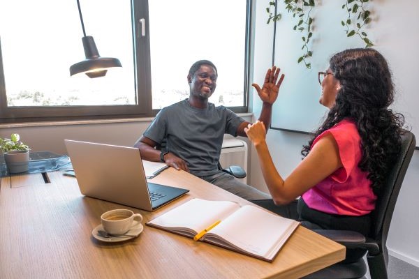 Higher ed staff member having a meeting with their sponsor