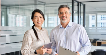 Dual career couple in higher ed smiling