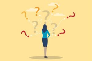 woman staring at question marks